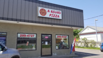 A Round Pizza outside